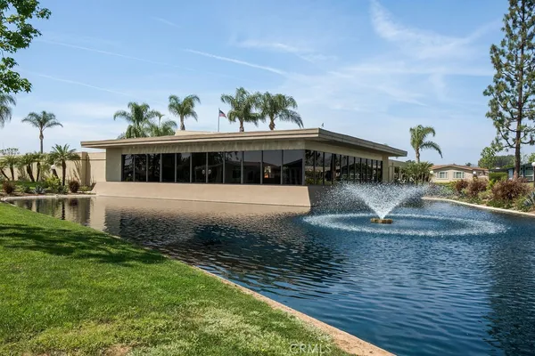 a view of a lake with a houses in the background