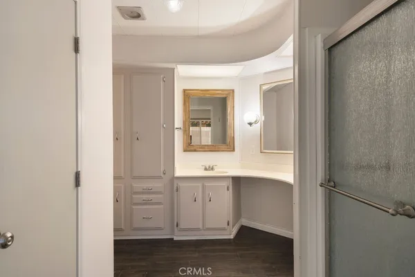 a bathroom with a sink toilet and vanity