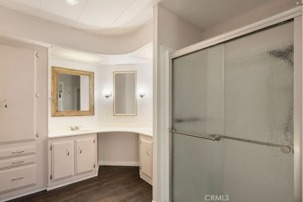 a bathroom with a window and a shower