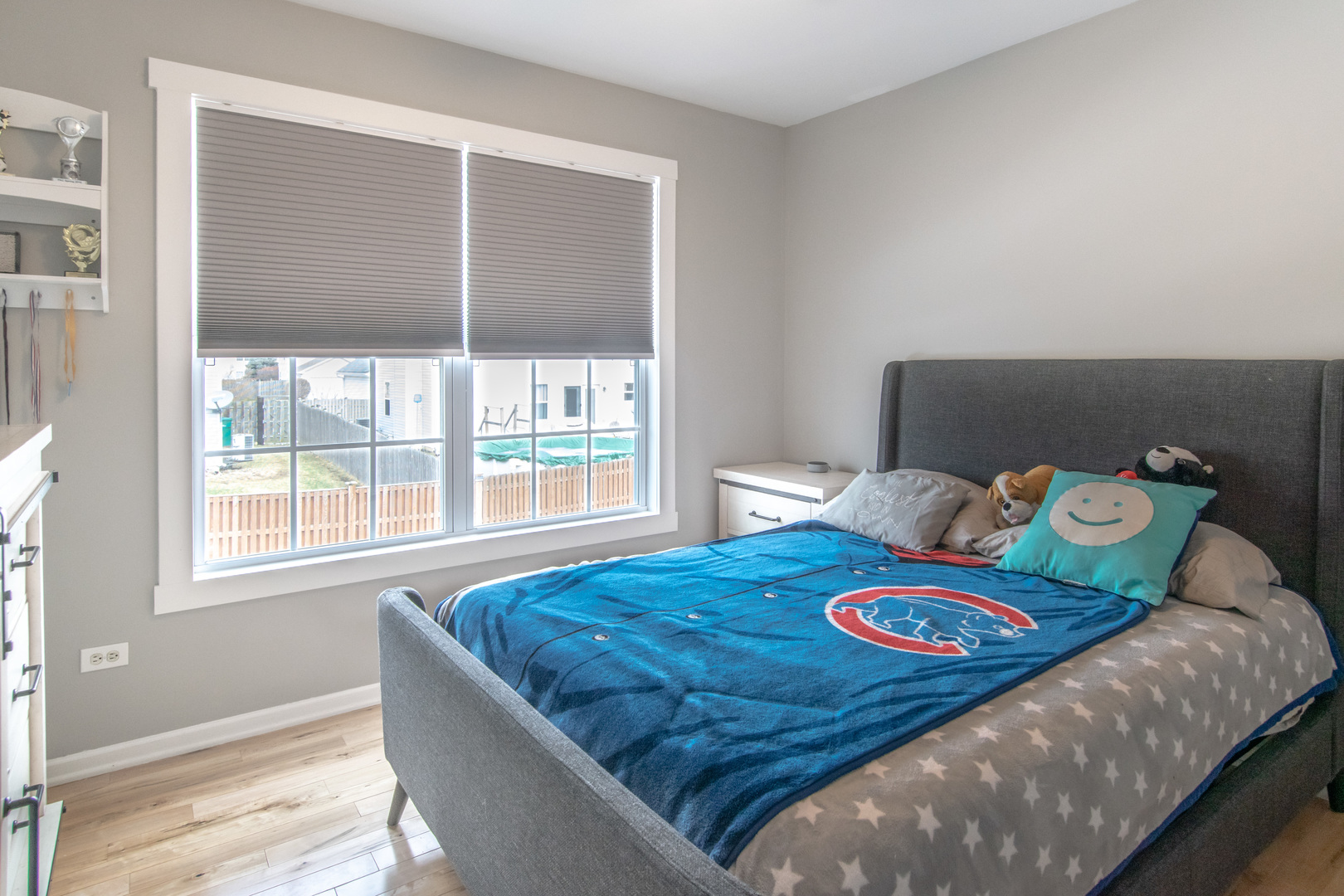 1938 Ashbrooke Road Romeoville, IL 60446 - Photo 22 of 42 a bed sitting in a bedroom next to a window
