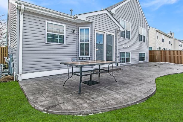 1938 Ashbrooke Road Romeoville, IL 60446 - Photo 40 of 42 a view of a house with backyard porch and sitting area