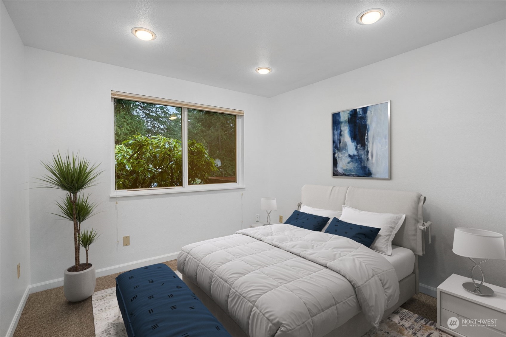 22904 49th Avenue Southeast Bothell, WA 98021 - Photo 24 of 38 a bedroom with a large bed and a potted plant