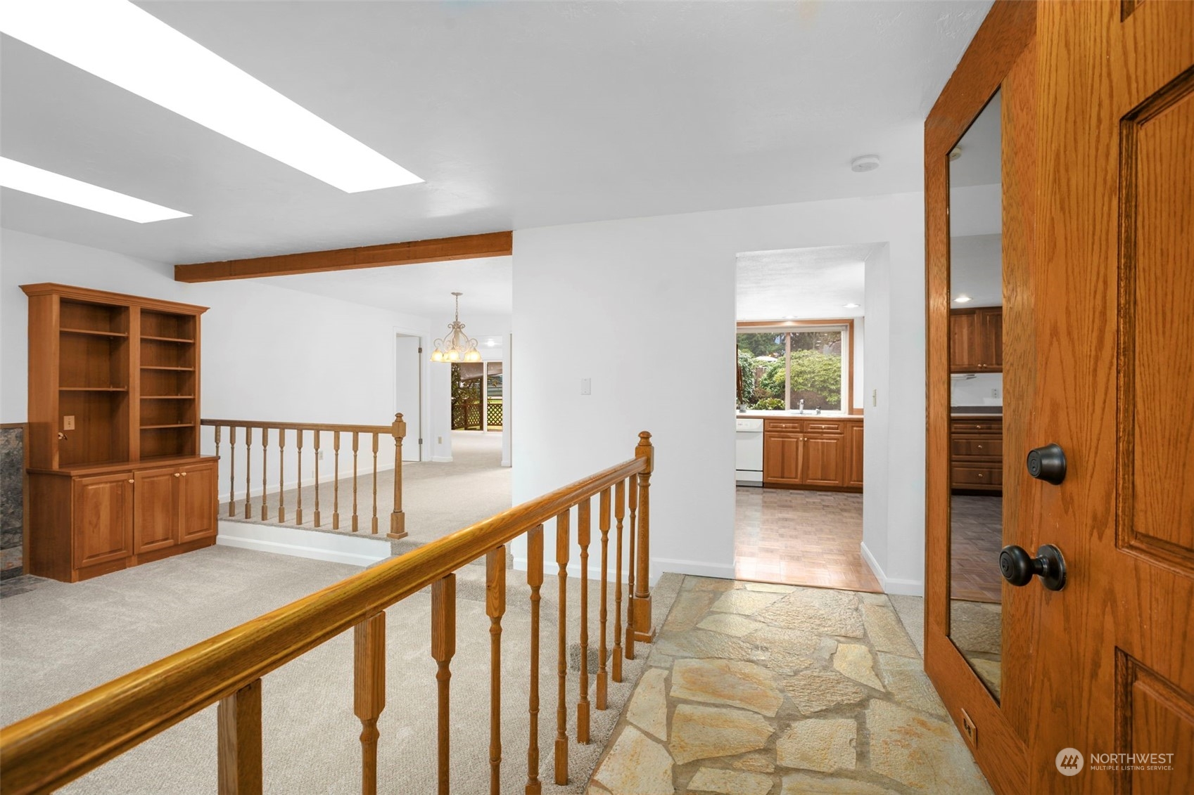 22904 49th Avenue Southeast Bothell, WA 98021 - Photo 4 of 38 a view of a hallway with wooden floor and windows