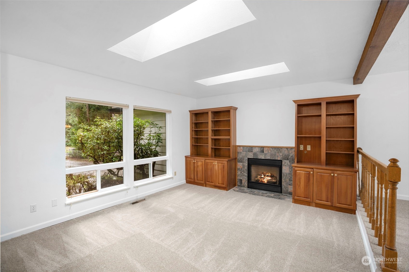 22904 49th Avenue Southeast Bothell, WA 98021 - Photo 6 of 38 an empty room with furniture and a fireplace
