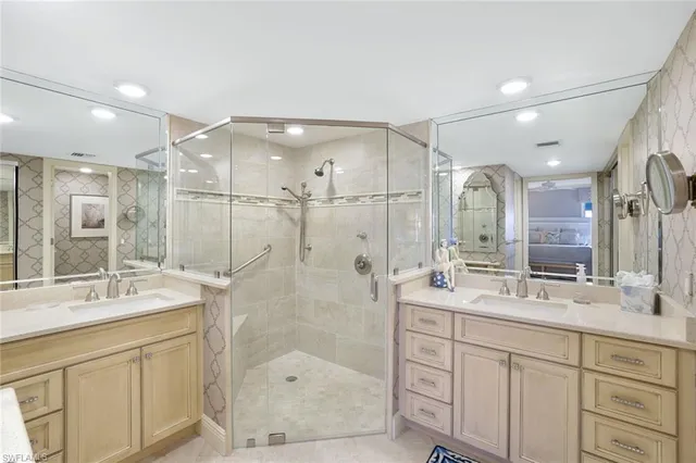 a bathroom with a shower sink double and mirror