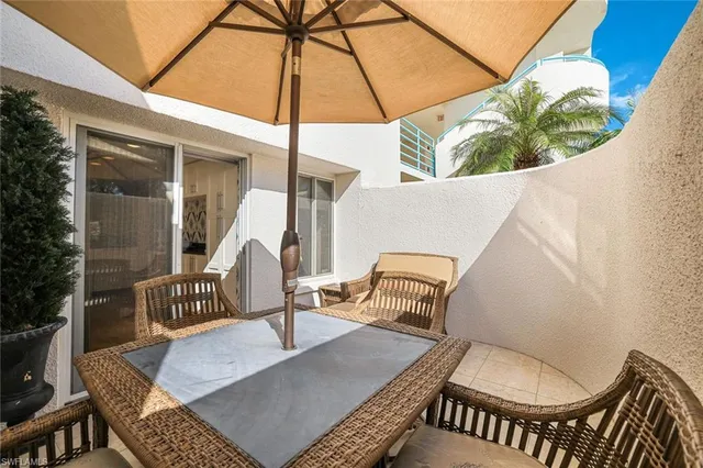 a balcony view with a couch and table