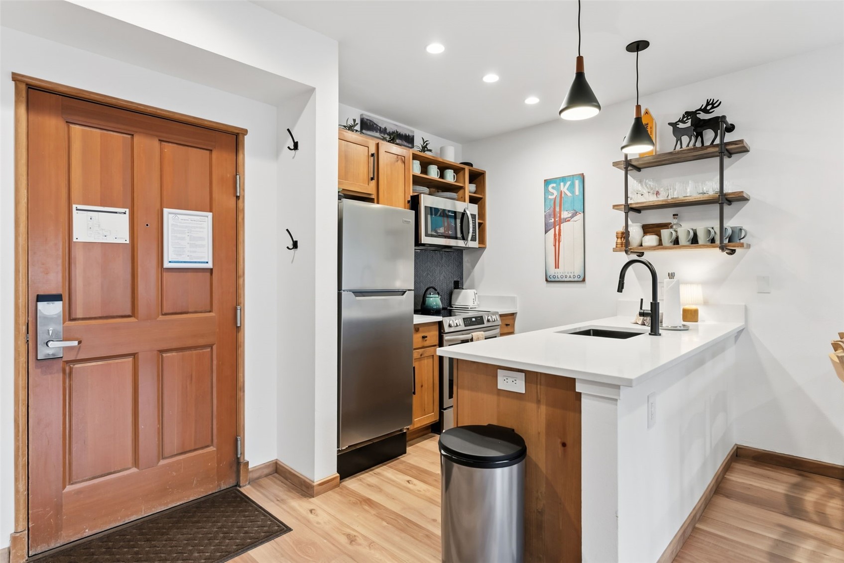 195 River Run Road, Unit 8015 Keystone, CO 80435 - Photo 10 of 35 a kitchen with stainless steel appliances granite countertop a refrigerator and a sink