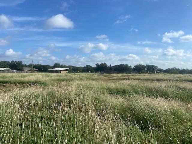 a view of a lake with houses in the back