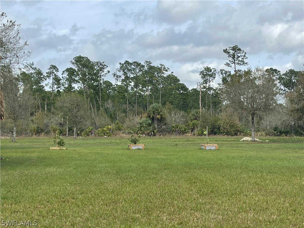 13434 Tangelo Avenue Clewiston, FL 33440 - Photo 27 of 42 a view of outdoor space with deck and yard