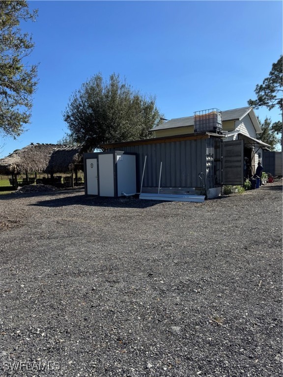 13434 Tangelo Avenue Clewiston, FL 33440 - Photo 30 of 42 a view of a house with a yard