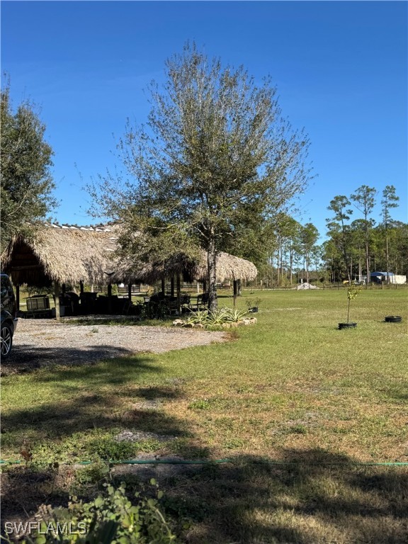 13434 Tangelo Avenue Clewiston, FL 33440 - Photo 32 of 42 a view of a pool with a yard