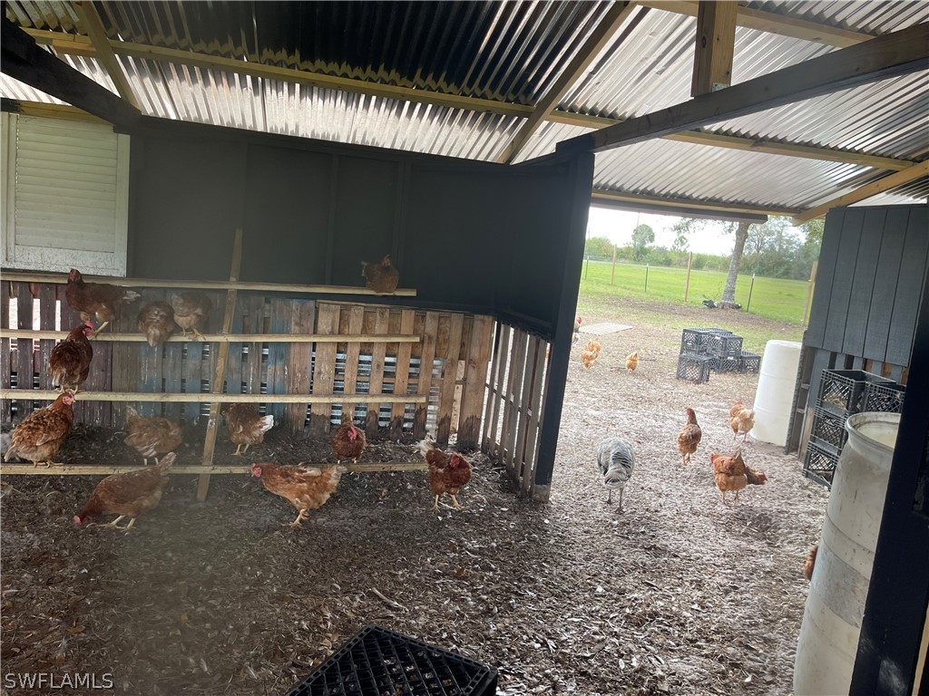 13434 Tangelo Avenue Clewiston, FL 33440 - Photo 10 of 42 a backyard of a house with table and chairs