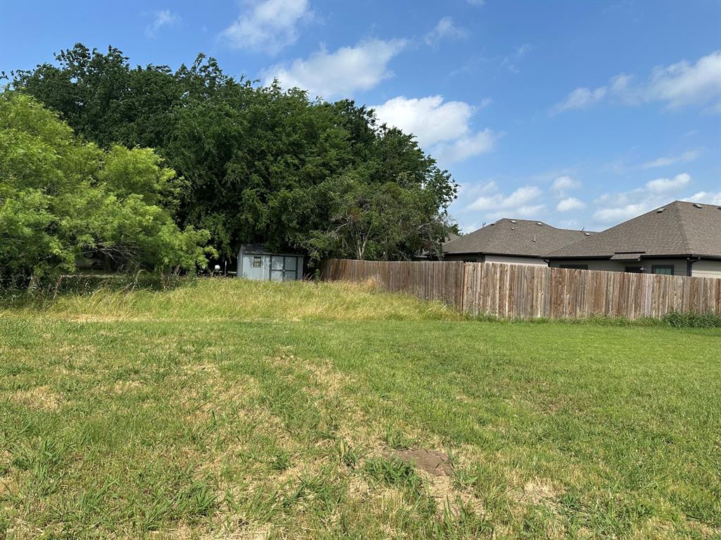 664 Gould Street Pilot Point, TX 76258 - Photo 2 of 3 a view of a backyard