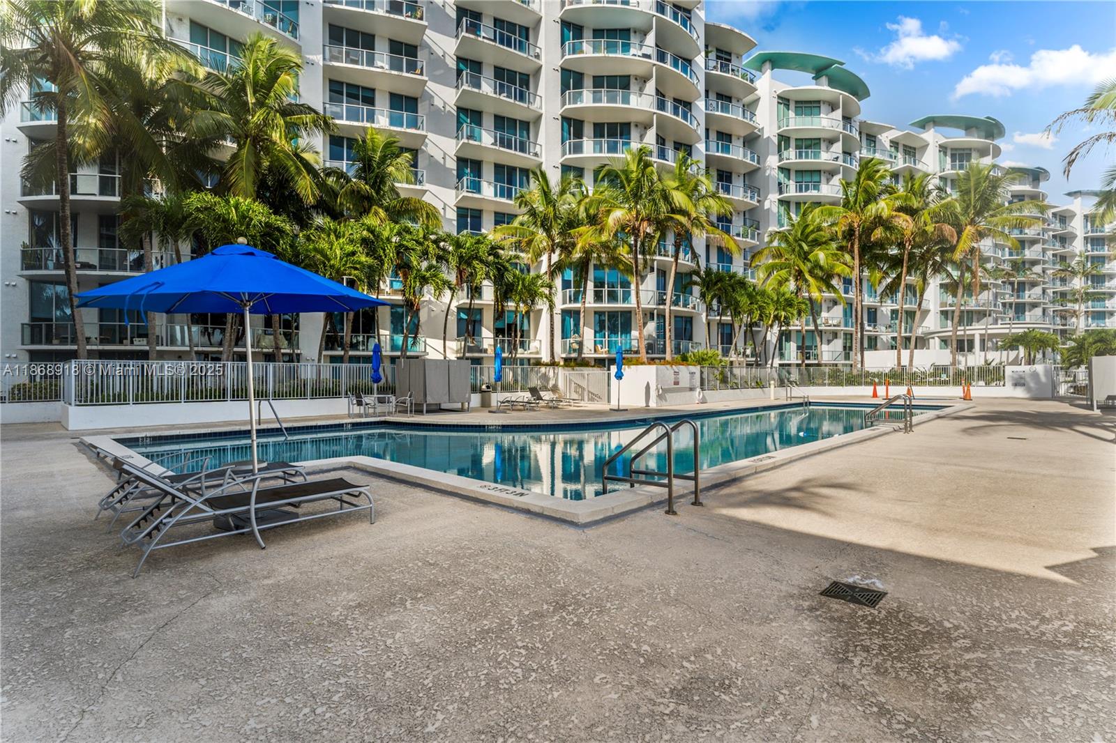 3029 Northeast 188th Street, Unit 924 Aventura, FL 33180 - Photo 14 of 20 a view of a patio with a table and chairs