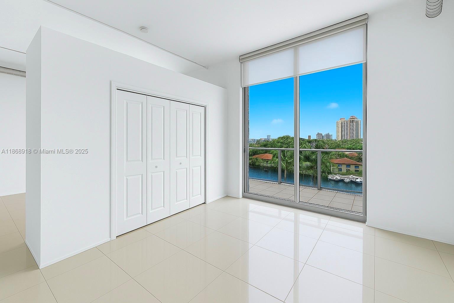 3029 Northeast 188th Street, Unit 924 Aventura, FL 33180 - Photo 6 of 20 an empty room with window