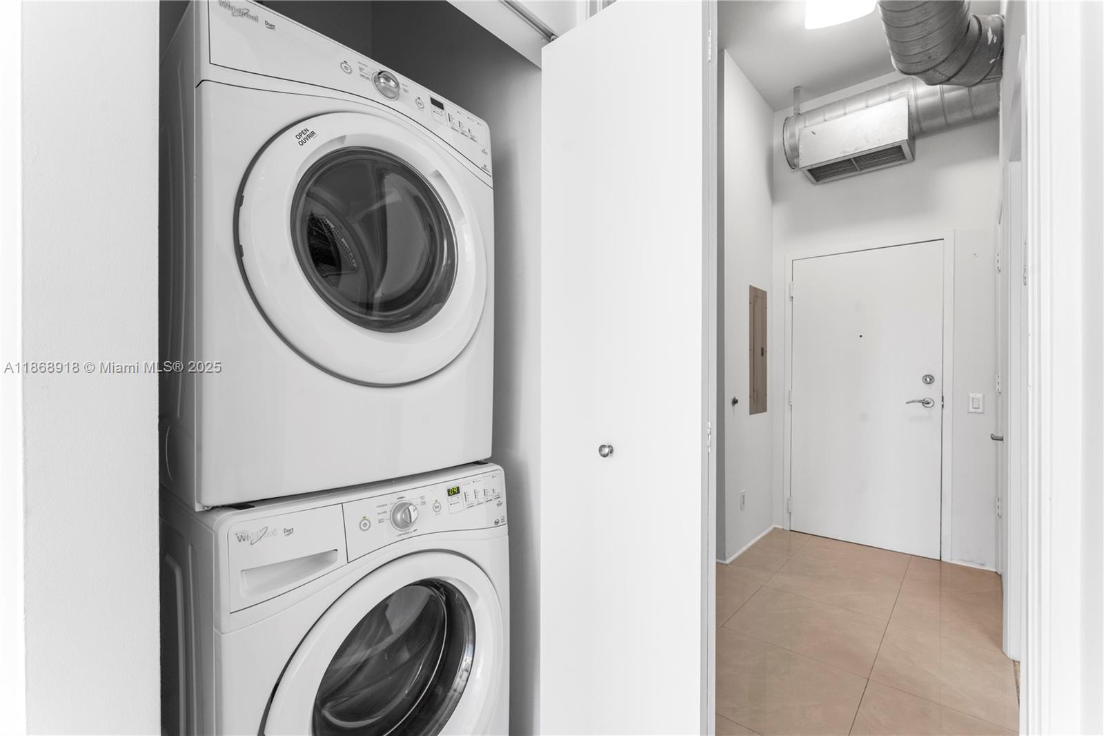 3029 Northeast 188th Street, Unit 924 Aventura, FL 33180 - Photo 8 of 20 a view of a hallway with washer and dryer