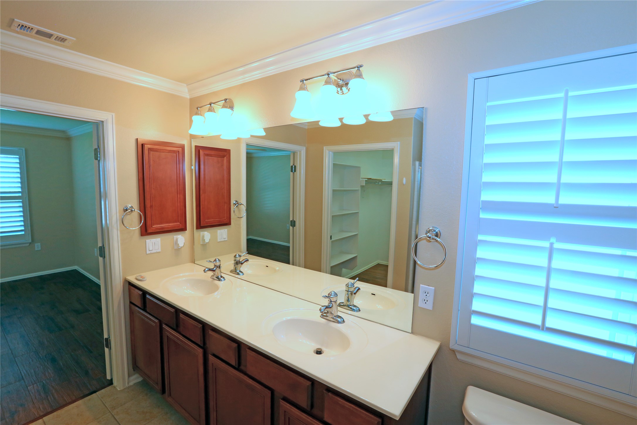 113 Monument Hill Trail Georgetown, TX 78633 - Photo 14 of 29 Full bath featuring double vanity, crown molding, and light tile patterned floors