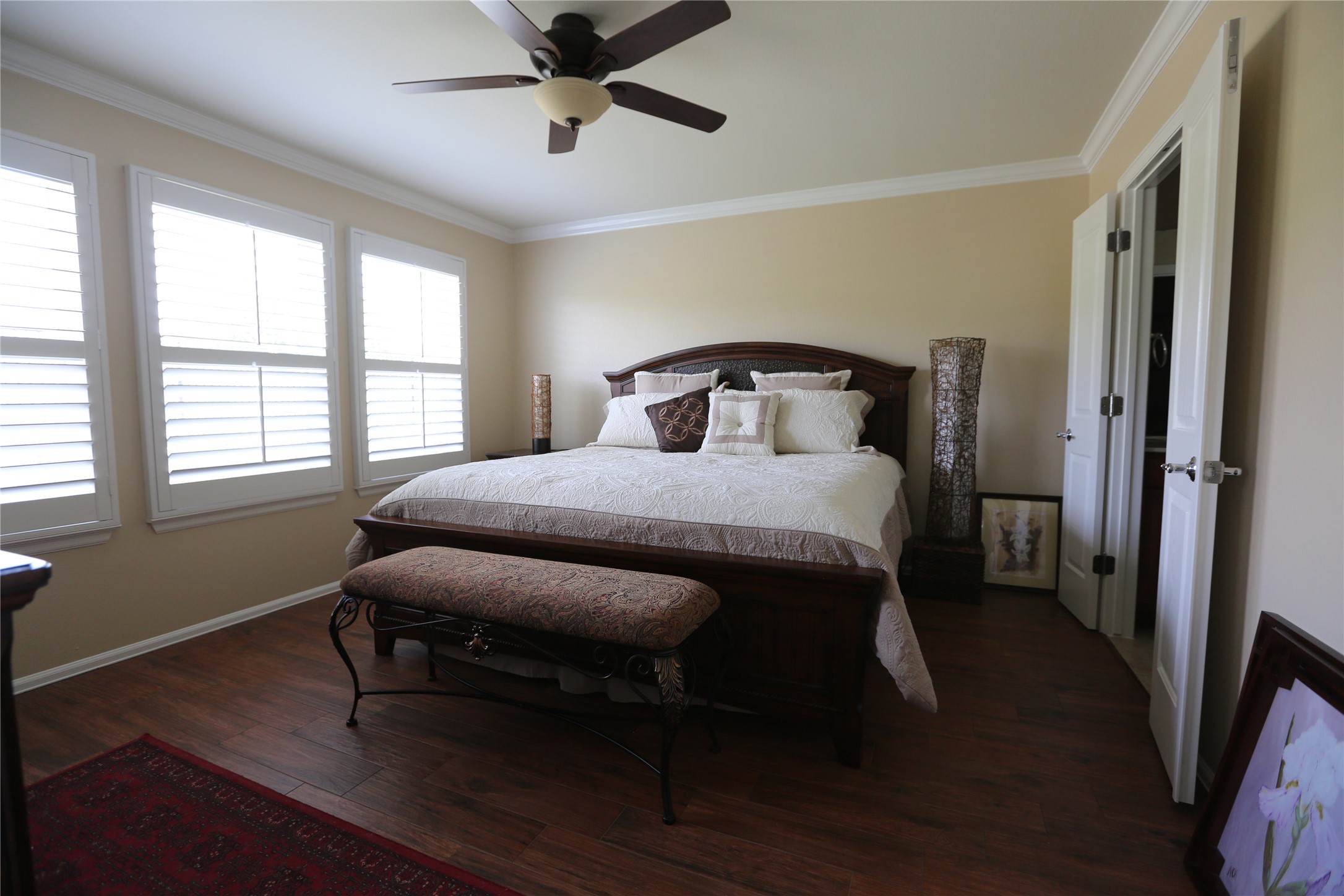 113 Monument Hill Trail Georgetown, TX 78633 - Photo 24 of 29 Bedroom with crown molding, dark wood-type flooring, and ceiling fan