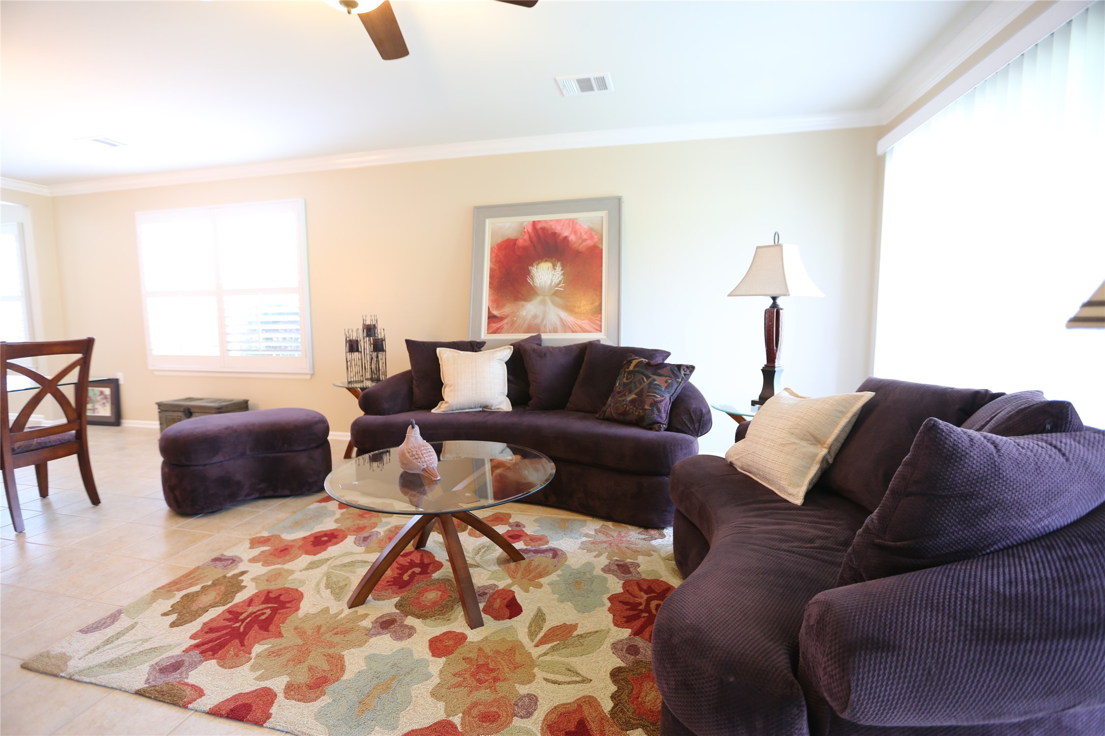 113 Monument Hill Trail Georgetown, TX 78633 - Photo 26 of 29 Living room with crown molding, ceiling fan, and light tile patterned flooring