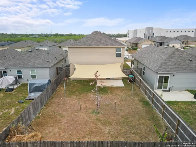 a view of a roof deck with furniture