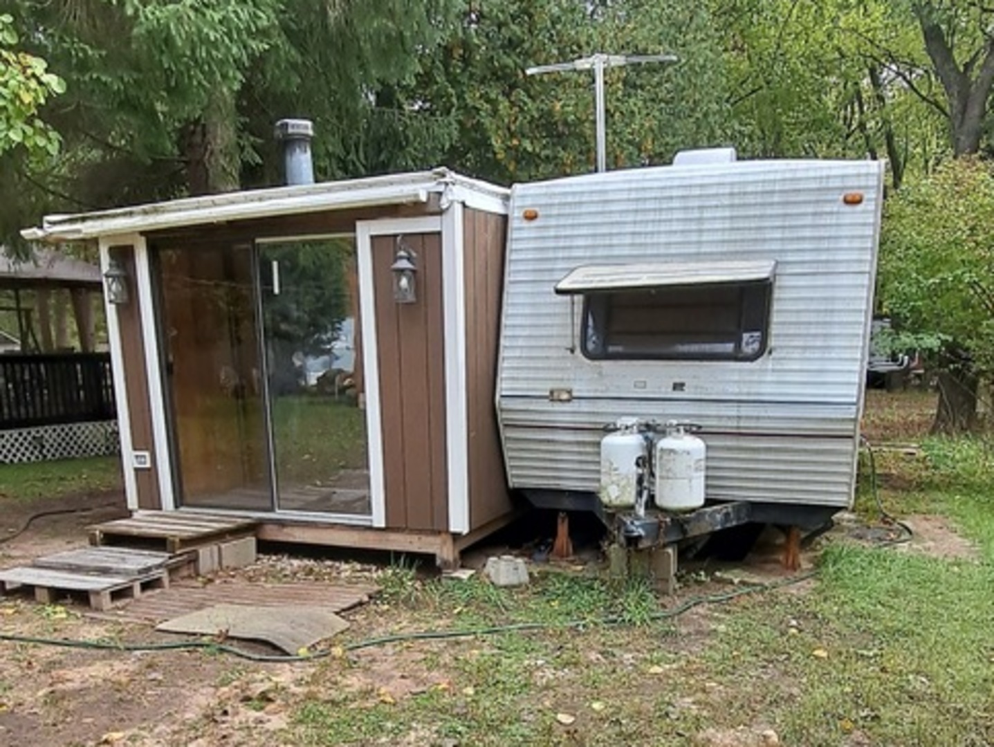 4-152 Woodhaven Lakes Sublette, IL 61367 - Photo 2 of 11 a view of house with backyard and outdoor seating