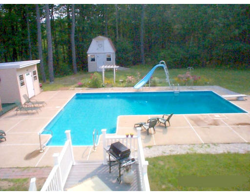 487 Reservoir Road Lunenburg, MA 01462 - Photo 1 of 22 a view of backyard with swimming pool and outdoor seating
