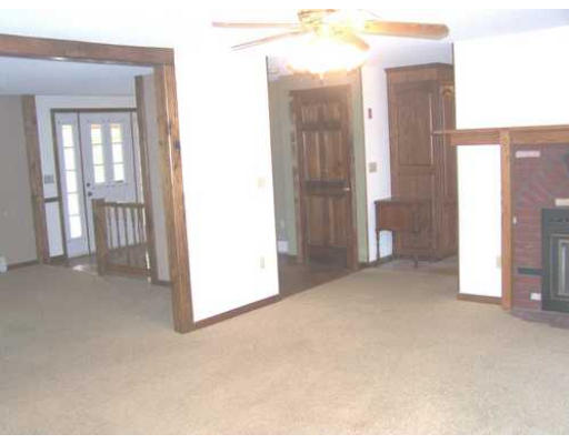 487 Reservoir Road Lunenburg, MA 01462 - Photo 11 of 22 a view of a room with an entryway and front door