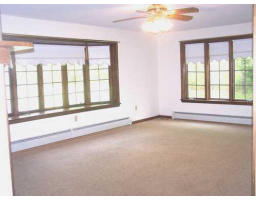487 Reservoir Road Lunenburg, MA 01462 - Photo 13 of 22 a view of an empty room with a window