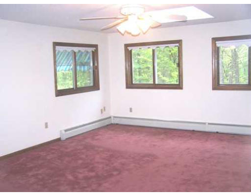 487 Reservoir Road Lunenburg, MA 01462 - Photo 15 of 22 an empty room with windows