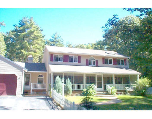 487 Reservoir Road Lunenburg, MA 01462 - Photo 22 of 22 a front view of a house with a yard table and chairs