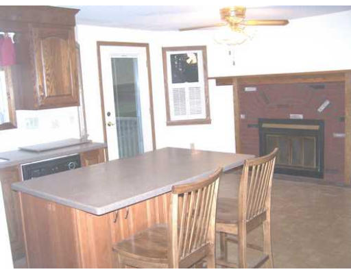 487 Reservoir Road Lunenburg, MA 01462 - Photo 5 of 22 a view of a dining room with furniture and a window