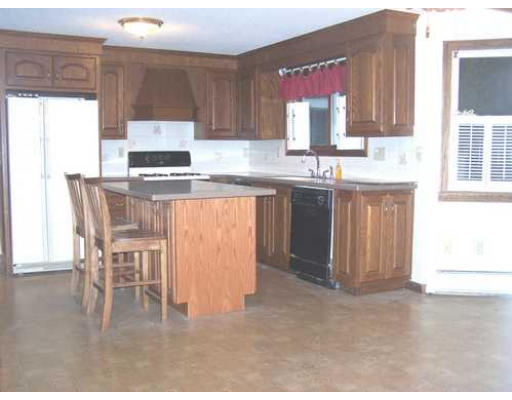487 Reservoir Road Lunenburg, MA 01462 - Photo 6 of 22 a kitchen with a sink cabinets and window