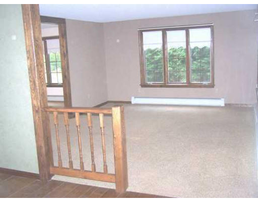 487 Reservoir Road Lunenburg, MA 01462 - Photo 9 of 22 a view of a room with wooden floor and windows