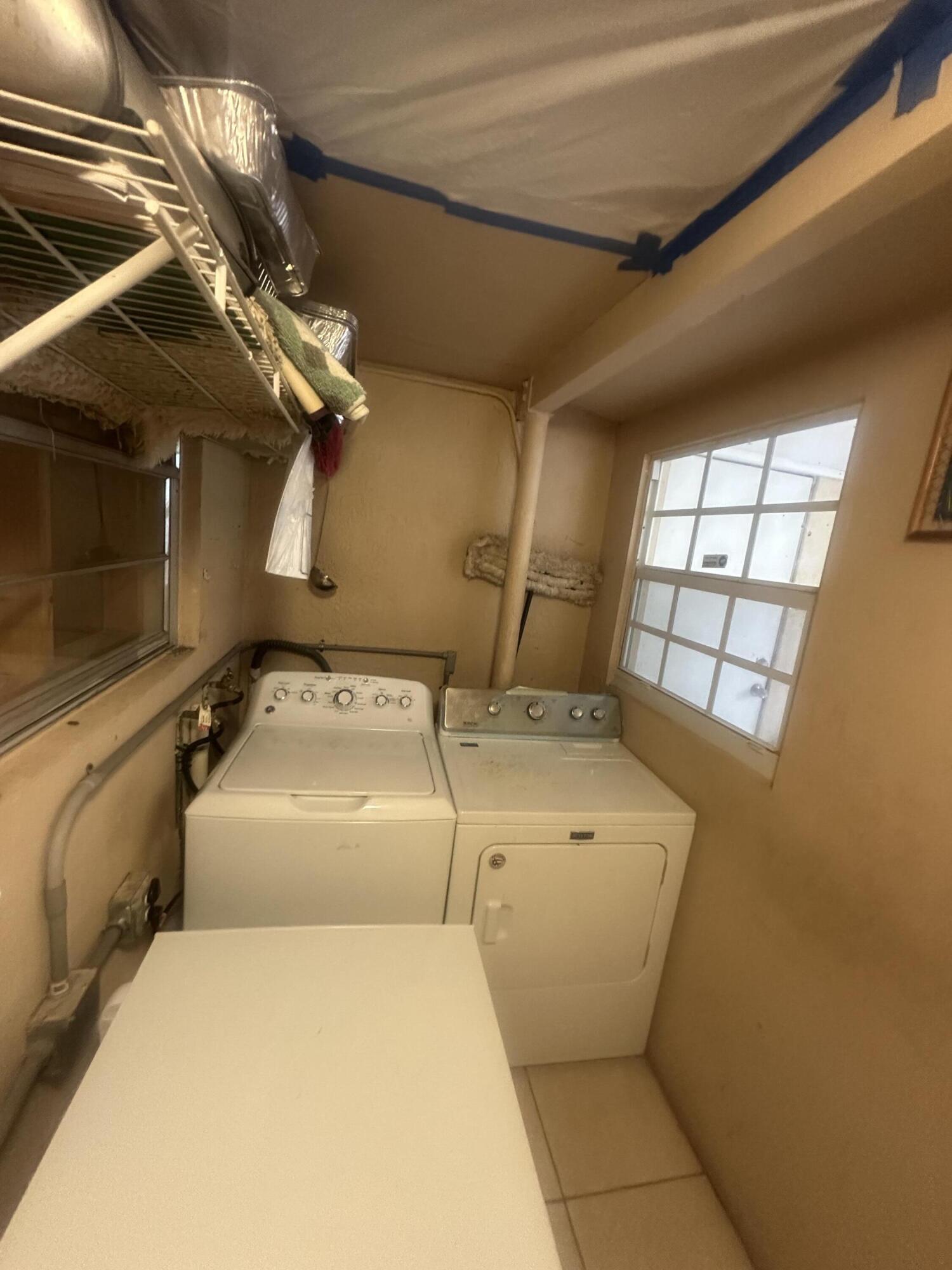 916 Caroline Avenue West Palm Beach, FL 33413 - Photo 11 of 14 a utility room with dryer and washer