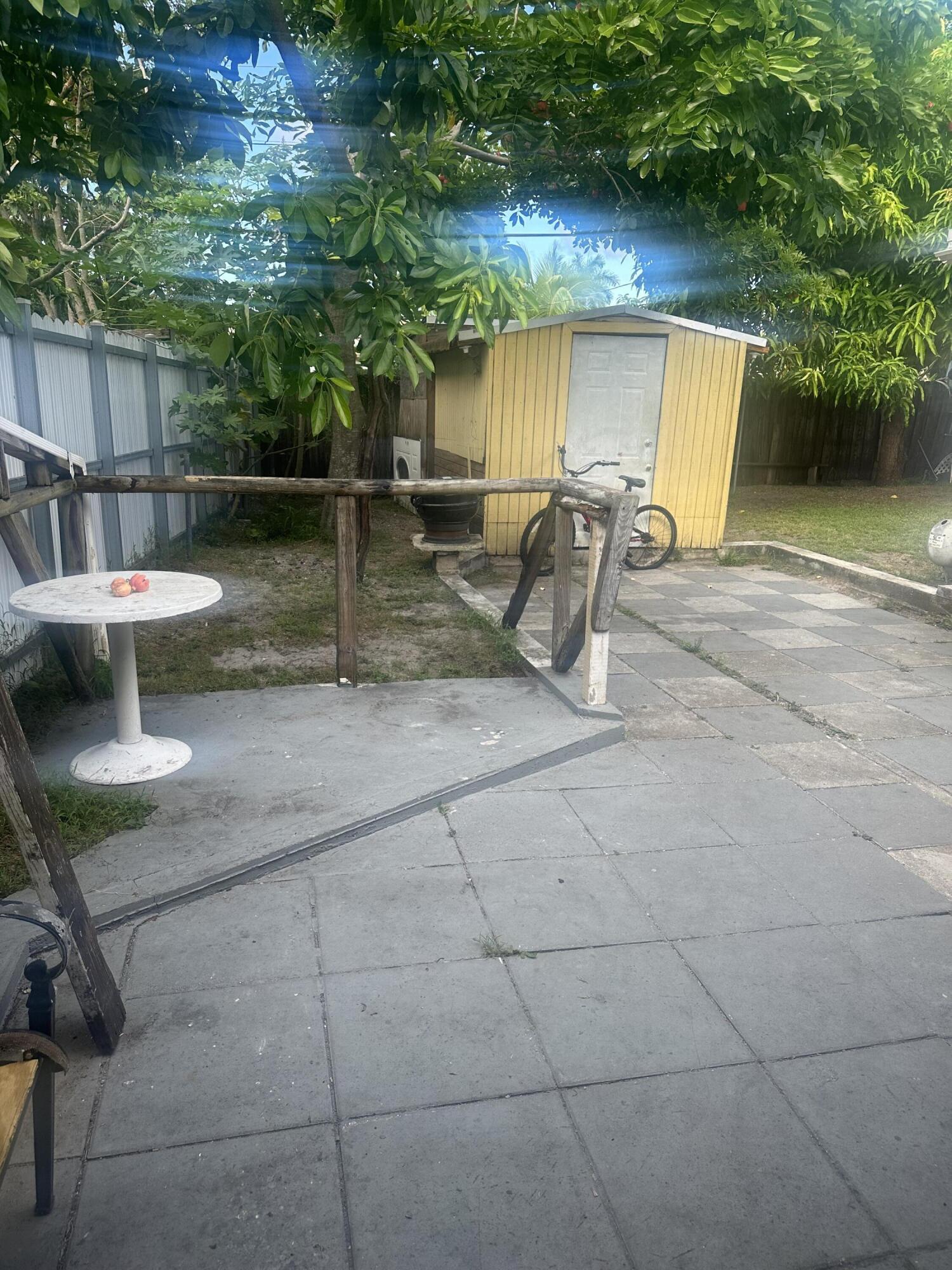 916 Caroline Avenue West Palm Beach, FL 33413 - Photo 12 of 14 a view of backyard with outdoor seating and barbeque oven