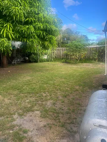 a view of a field with an trees