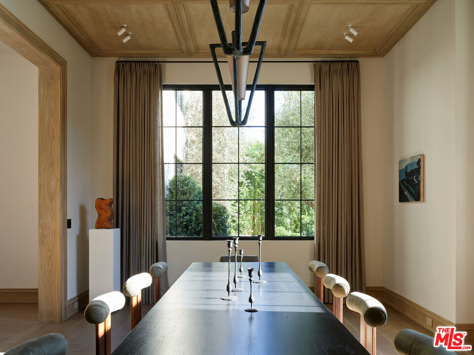694 North Tigertail Road Los Angeles, CA 90049 - Photo 13 of 34 a living room with furniture and a large window