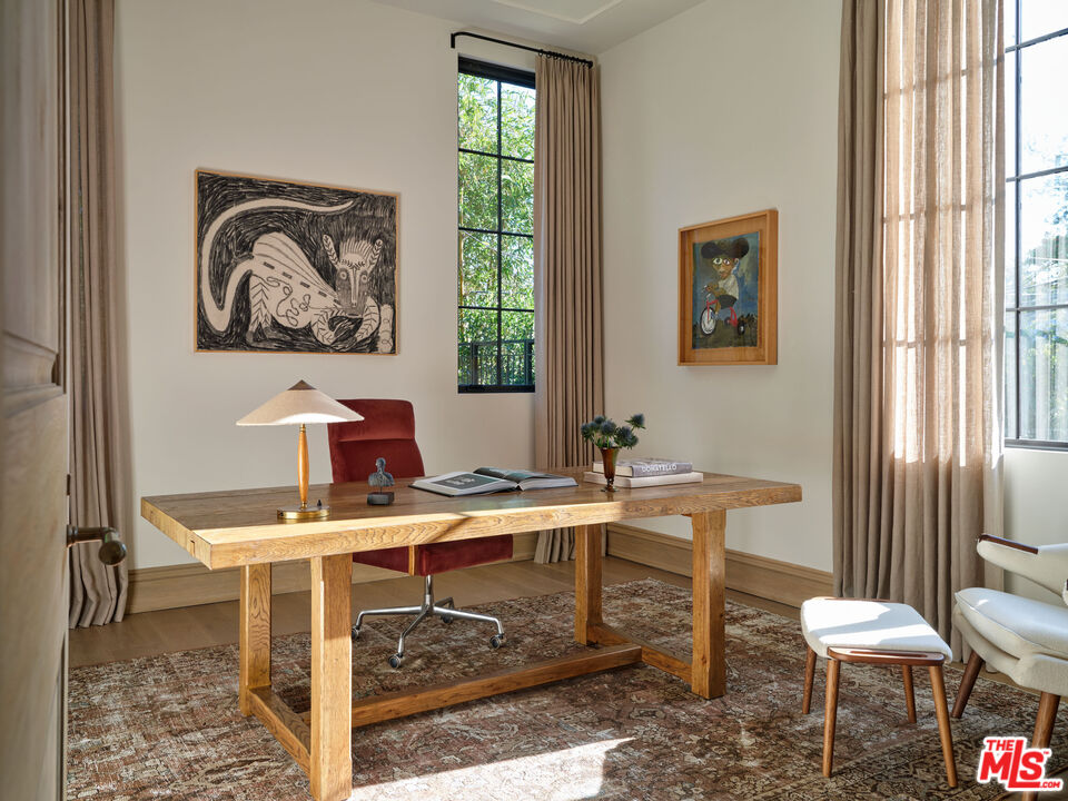 694 North Tigertail Road Los Angeles, CA 90049 - Photo 14 of 34 a view of a workspace with furniture and a window