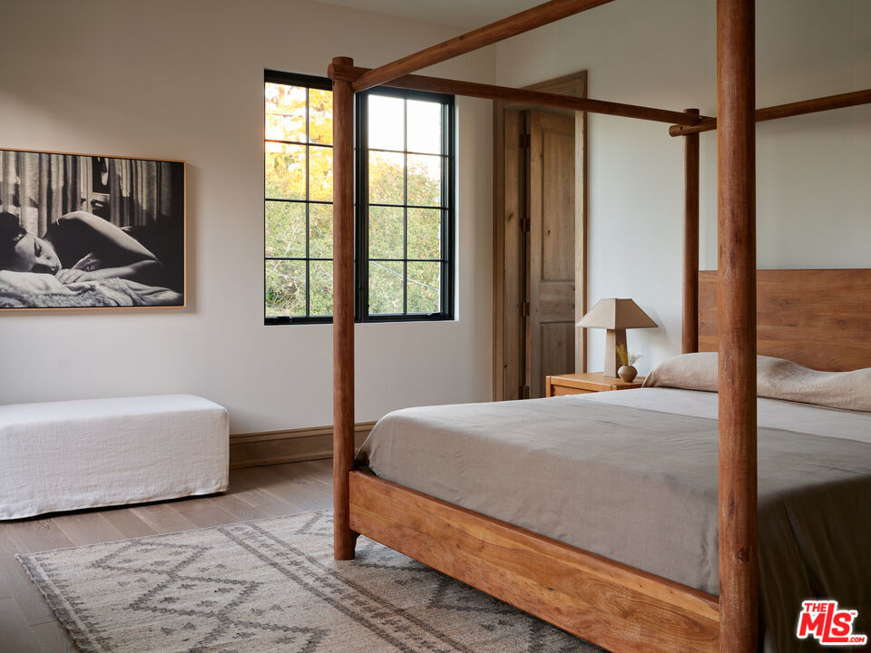 694 North Tigertail Road Los Angeles, CA 90049 - Photo 24 of 34 a bedroom with a bed and a window