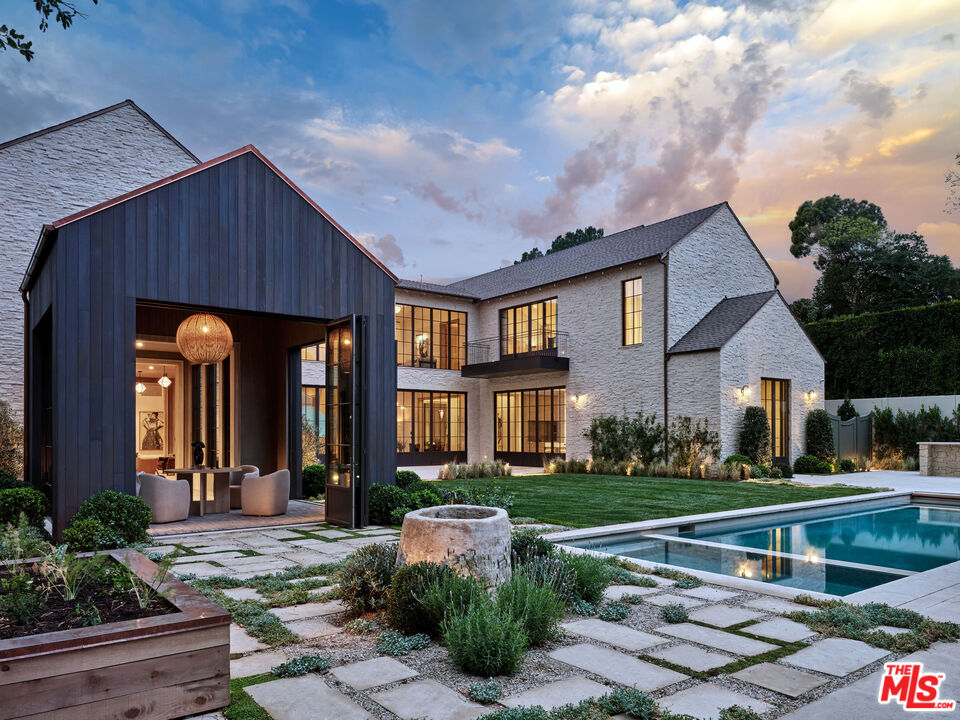 694 North Tigertail Road Los Angeles, CA 90049 - Photo 31 of 34 a front view of a house with garden