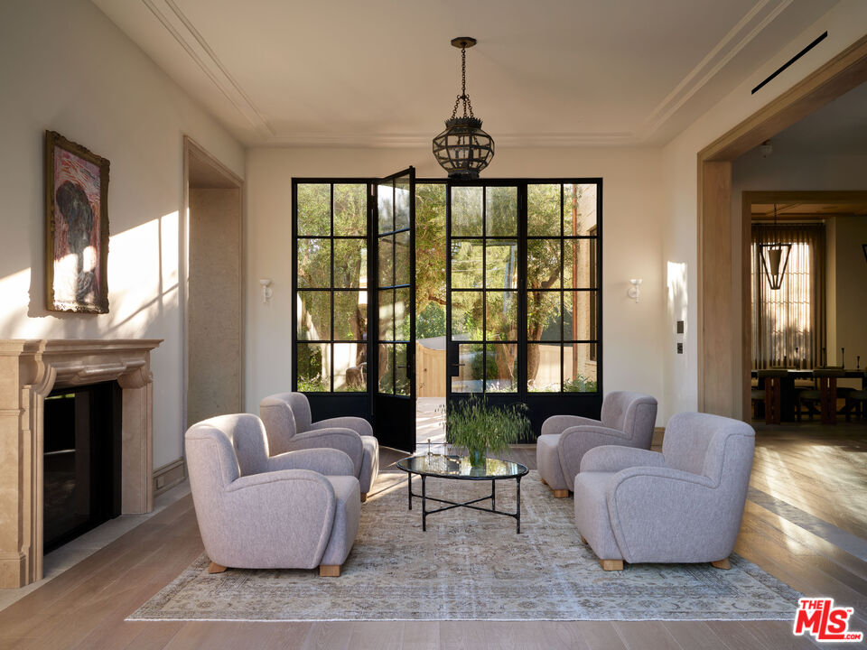 694 North Tigertail Road Los Angeles, CA 90049 - Photo 4 of 34 a living room with furniture and a fireplace