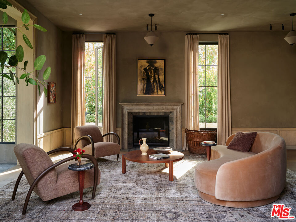 694 North Tigertail Road Los Angeles, CA 90049 - Photo 5 of 34 a living room with furniture and a fireplace