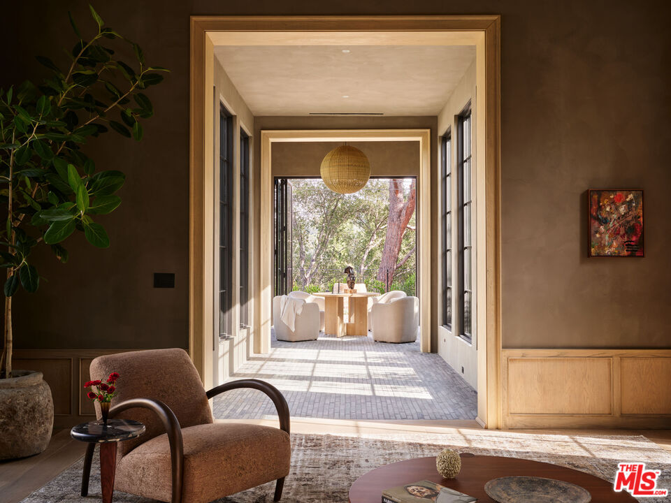 694 North Tigertail Road Los Angeles, CA 90049 - Photo 6 of 34 a living room with furniture and a potted plant