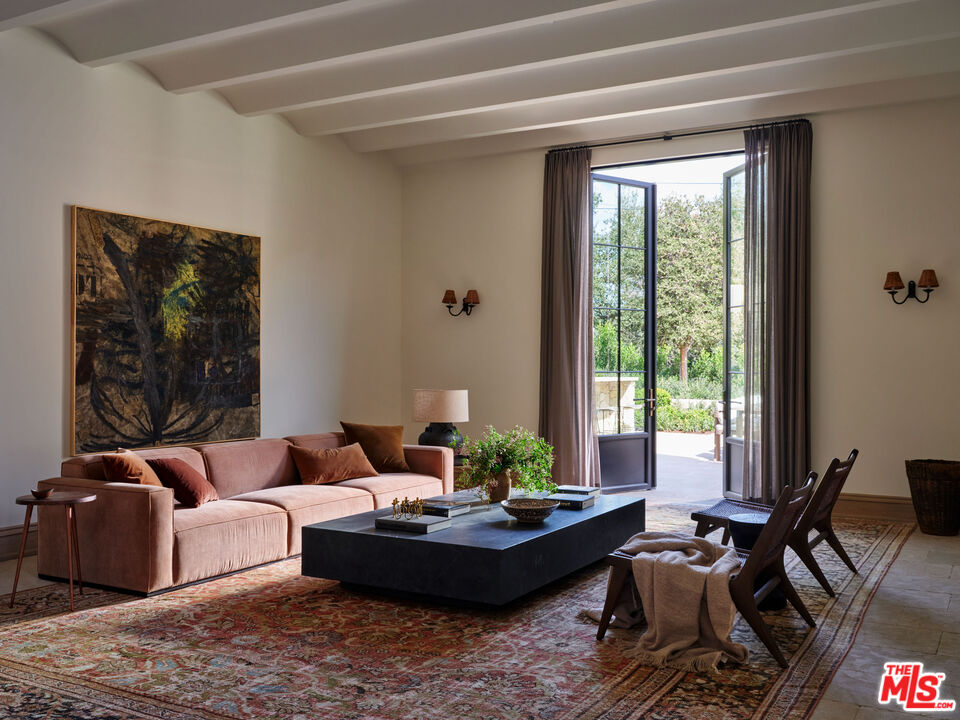694 North Tigertail Road Los Angeles, CA 90049 - Photo 8 of 34 a living room with furniture and a large window