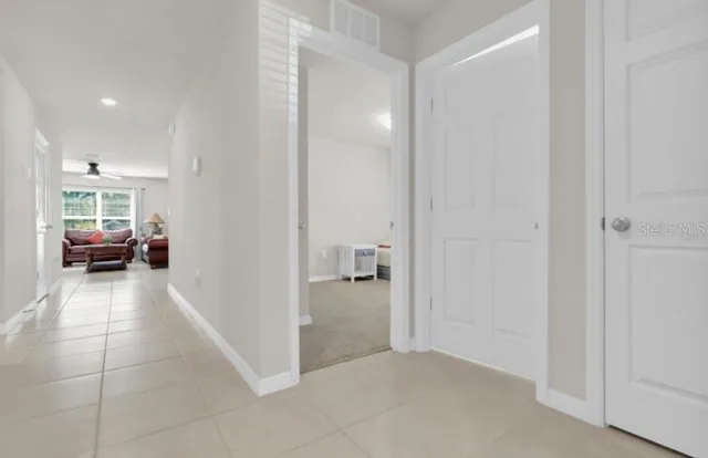 a view of a livingroom with furniture and a window
