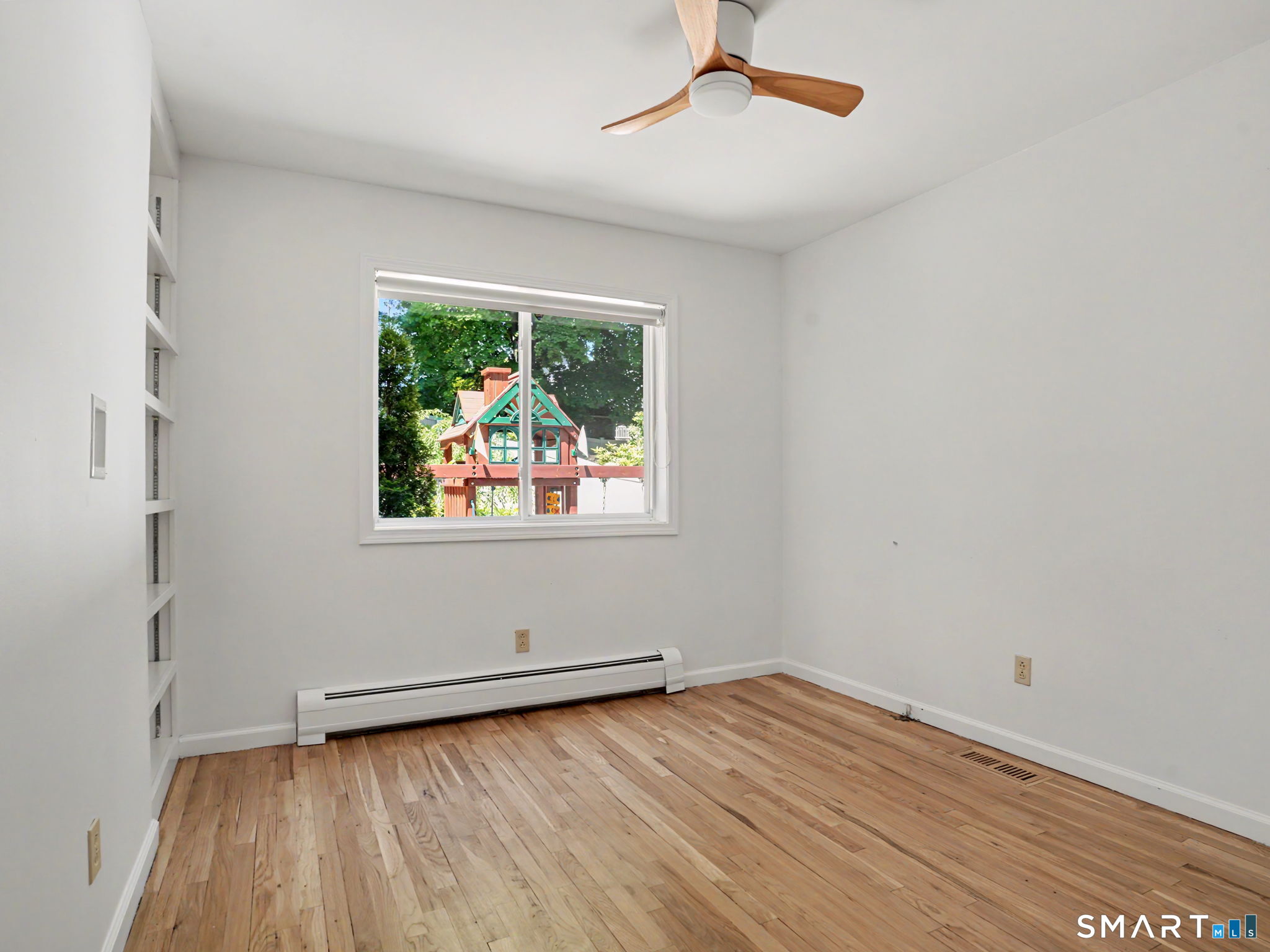 26 Abbott Avenue Ridgefield, CT 06877 - Photo 17 of 40 This small den/office is located on the main floor with bookshelves and view of backyard