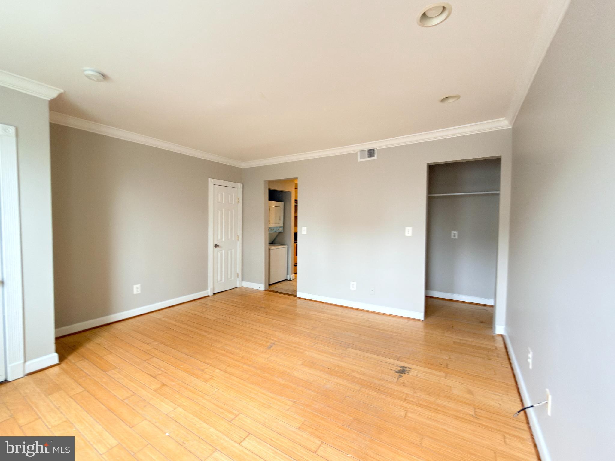 1246 Queen Street Northeast, Unit 2 Washington, DC 20002 - Photo 3 of 23 Spacious room with warm wooden floors.