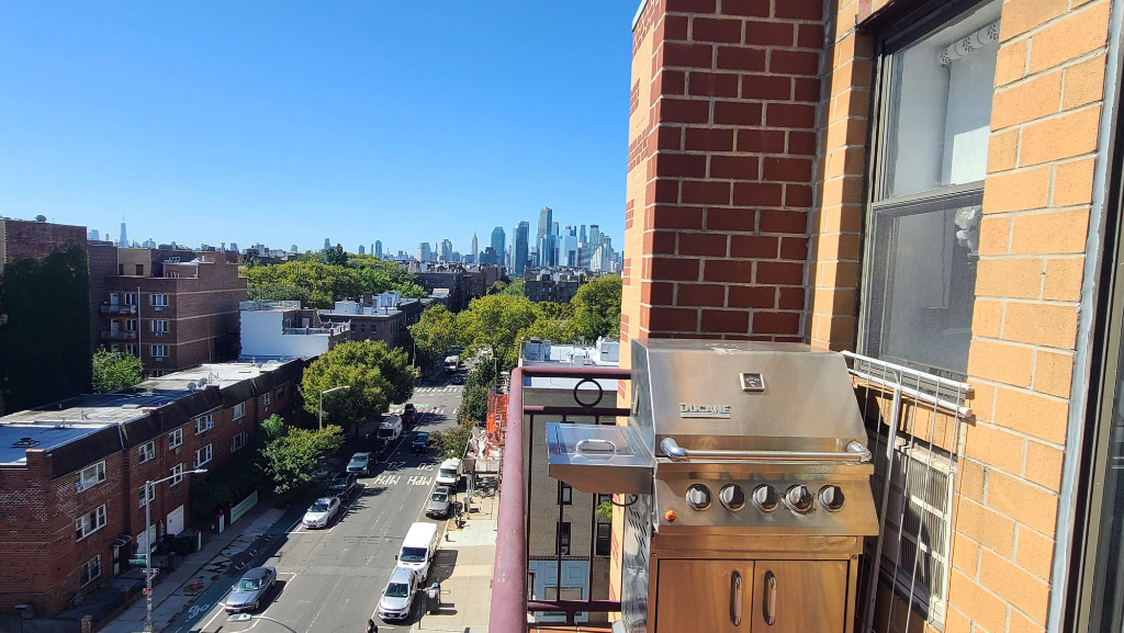 49-07 43rd Avenue, Unit 7F Queens, NY 11377 - Photo 11 of 16 a view of a buildings with a outdoor space