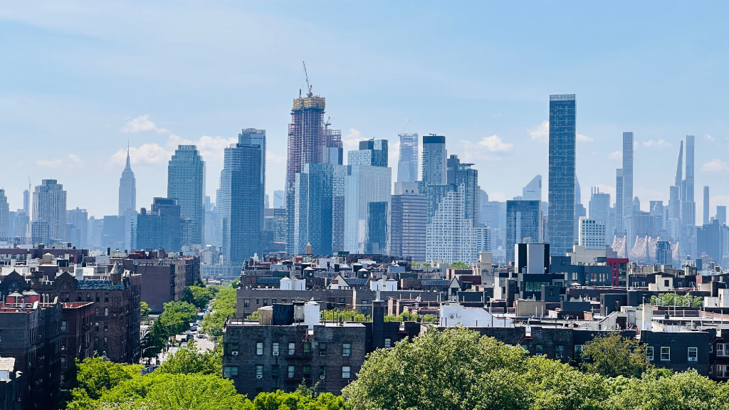 49-07 43rd Avenue, Unit 7F Queens, NY 11377 - Photo 12 of 16 a view of a city with tall buildings