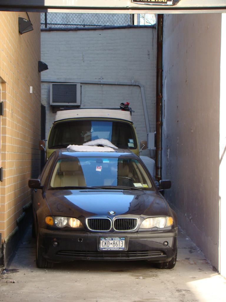 49-07 43rd Avenue, Unit 7F Queens, NY 11377 - Photo 13 of 16 a car parked in garage